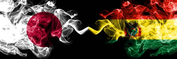 Japan vs Bolivia, Bolivian smoky mystic flags placed side by side. Thick colored silky smokes combination of Bolivia, Bolivian and Japanese flag — Stock Photo, Image