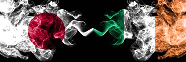 Japan vs Ireland, Irish smoky mystic flags placed side by side. Thick colored silky smokes combination of Ireland, Irish and Japanese flag — Stock Photo, Image