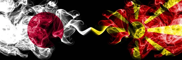 Japan vs Macedonia, Macedonian smoky mystic flags placed side by side. Thick colored silky smokes combination of Macedonia, Macedonian and Japanese flag — Stock Photo, Image