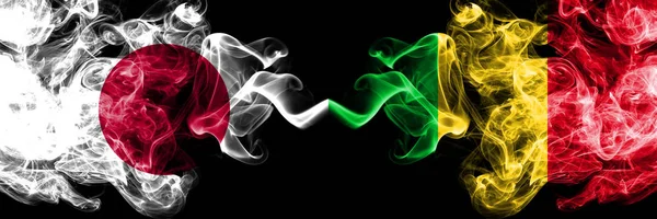 Japan vs Mali smoky mystic flags placed side by side. Thick colored silky smokes combination of Mali and Japanese flag — Stock Photo, Image