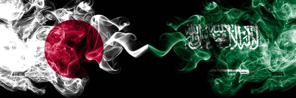 Japan vs Saudiarabien, arabiska rökig Mystic flaggor placerade sida vid sida. Tjocka färgade silkeslena röker kombination av Saudiarabien, arabiska och japanska flaggan — Stockfoto