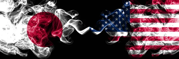 Japan vs United States of America, American smoky mystic flags placed side by side. Thick colored silky smokes combination of United States of America, American and Japanese flag — Stock Photo, Image