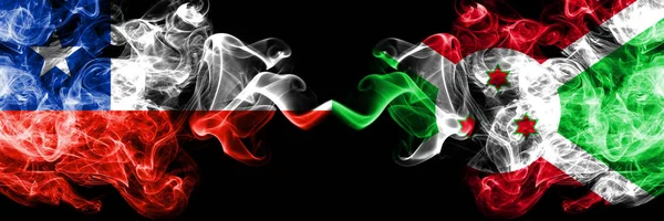 Chile vs Burundi, Burundian smoky mystic flags placed side by side. Thick colored silky smokes combination of Burundi, Burundian and Chilean flag — Stock Photo, Image