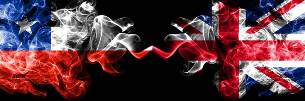 Chile vs United Kingdom, British smoky mystic flags placed side by side. Thick colored silky smokes combination of United Kingdom, British and Chilean flag — Stock Photo, Image