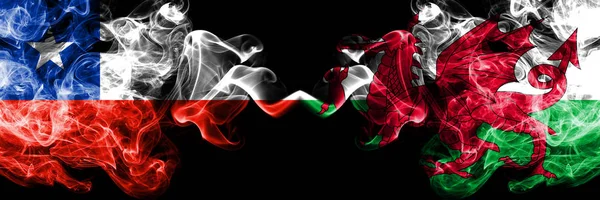 Chile vs Wales, Welsh smoky mystic flags placed side by side. Thick colored silky smokes combination of Wales, Welsh and Chilean flag — Stock Photo, Image