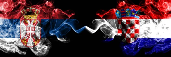 Serbia vs Croatia, Croatian smoky mystic flags placed side by side. Thick colored silky smokes combination of Serbian and Croatia, Croatian flag — Stock Photo, Image