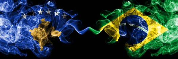 Косово против Бразилии, бразильские дымящиеся мистические флаги, размещенные бок о бок. Толстый шелковистый курит сочетание Косово и Бразилии, бразильский флаг — стоковое фото