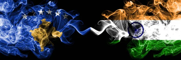 Kosovo vs India, Indian smoky mystic flags placed side by side. Thick colored silky smokes combination of Kosovo and India, Indian flag