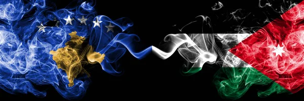 Kosovo vs Jordan, jordanska rökig Mystic flaggor placerade sida vid sida. Tjocka färgade silkeslena röker kombination av Kosovo och Jordanien, Jordansk flagga — Stockfoto