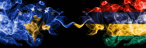 Kosovo vs Mauritius, Mauritian smoky mystic flags placed side by side. Thick colored silky smokes combination of Kosovo and Mauritius, Mauritian flag — Stock Photo, Image