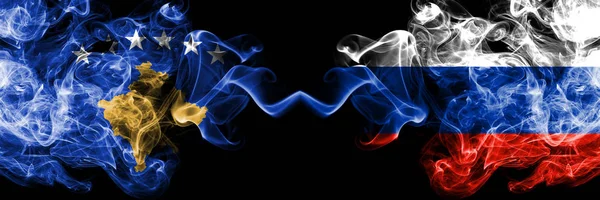 Kosovo vs Russia, Russian smoky mystic flags placed side by side. Thick colored silky smokes combination of Kosovo and Russia, Russian flag — Stock Photo, Image