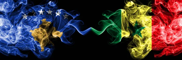 Kosovo vs Senegal, Senegalese smoky mystic flags placed side by side. Thick colored silky smokes combination of Kosovo and Senegal, Senegalese flag — Stock Photo, Image