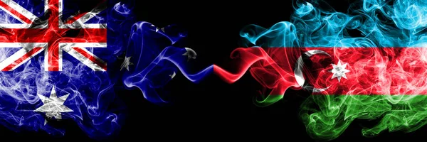 Australië VS Azerbeidzjan, Azerbeidzjaanse rokerige Mystic vlaggen geplaatst naast elkaar. Dikke gekleurde zijdeachtige rookt combinatie van nationale vlaggen van Australië en Azerbeidzjan, Azerbeidzjaans — Stockfoto