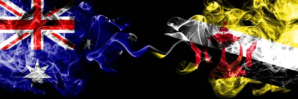 Australien gegen Brunei, brüneeische rauchige mystische Fahnen nebeneinander platziert. dicken farbigen seidigen Rauch Kombination von Nationalflaggen von Australien und Brunei, Bruneian — Stockfoto