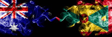 Avustralya vs Grenada dumanlı mistik bayraklar yan yana yerleştirilir. Avustralya ve Grenada ulusal bayrakları kalın renkli ipeksi dumanlar kombinasyonu