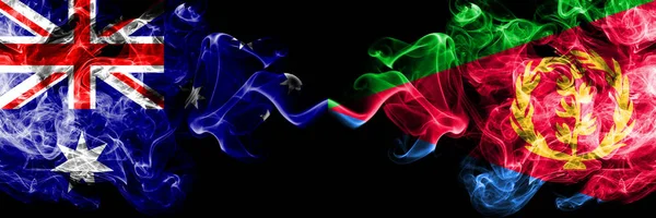 Australia vs Eritrea smoky mystic flags placed side by side. Thick colored silky smokes combination of national flags of Australia and Eritrea — Stock Photo, Image