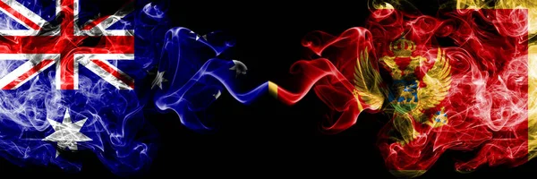 Австралия - Черногория, Черногория - курящие мистические флаги, расположенные рядом. Толстые цветные шелковистые курева сочетание национальных флагов Австралии и Черногории, Черногории — стоковое фото