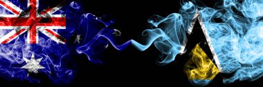 Avustralya vs Saint Lucia dumanlı mistik bayraklar yan yana yerleştirilir. Avustralya ve Saint Lucia ulusal bayrakları kalın renkli ipeksi dumanlar kombinasyonu