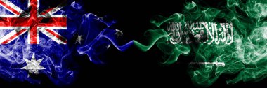 Avustralya vs Suudi Arabistan, Arap dumanlı mistik bayraklar yan yana yerleştirilir. Kalın renkli ipeksi Avustralya ve Suudi Arabistan, Arap ulusal bayrakları kombinasyonu sigara