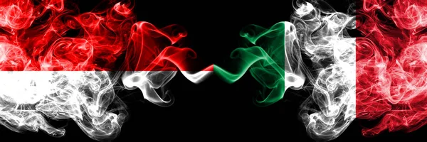 Indonesia vs Italy, Italian smoky mystic flags placed side by side. Thick colored silky smoke flags of Indonesia and Italy, Italian — Stock Photo, Image