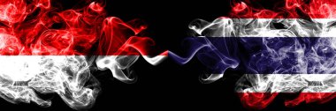 Endonezya vs Tayland, Tayland dumanlı mistik bayraklar yan yana yerleştirilir. Endonezya ve Tayland, Tay kalın renkli ipeksi duman bayrakları
