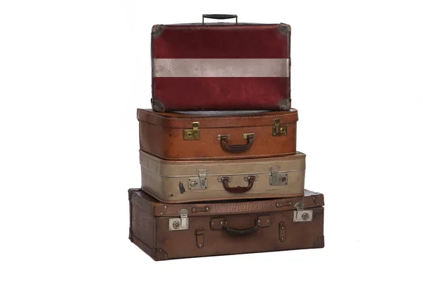 Latvia, Latvian travel concept. Group of vintage suitcases isolated on white background. — Stock Photo, Image