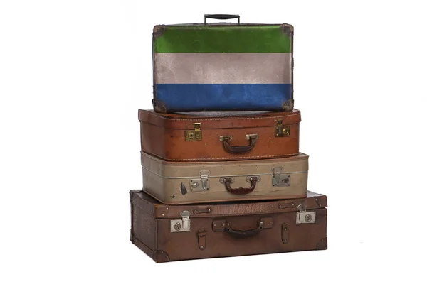 Sierra Leone concetto di viaggio. Gruppo di valigie vintage isolate su sfondo bianco . — Foto Stock