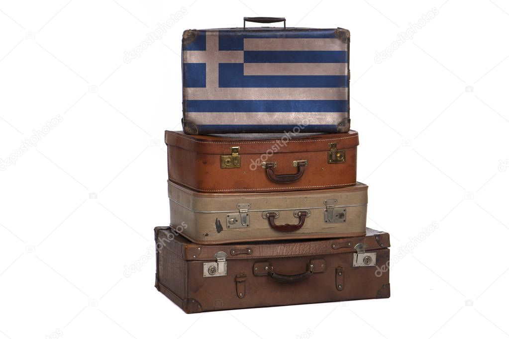Greece, Greek travel concept. Group of vintage suitcases isolated on white background.