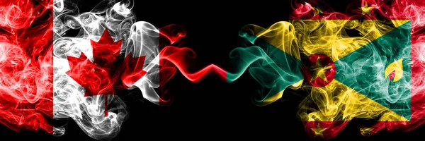 Canada vs Grenada bandiere mistiche fumose affiancate. Bandiere di fumo spesse colorate di seta di Canada e Grenada . — Foto Stock