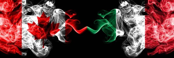 Canadá vs Italia, banderas místicas italianas colocadas una al lado de la otra. Banderas de humo sedoso de color grueso de Canadá e Italia, italiano . — Foto de Stock