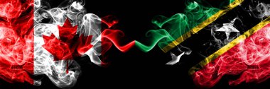 Kanada vs Saint Kitts ve Nevis dumanlı mistik bayraklar yan yana yerleştirilir. Kanada ve Saint Kitts ve Nevis kalın renkli ipeksi duman bayrakları.