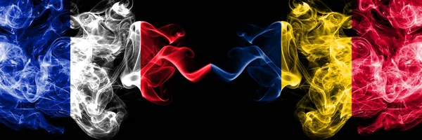 France vs Chad, Chadian smoky mystic flags placed side by side. Thick colored silky abstract smoke banner of French and Chad, Chadian — Stock Photo, Image