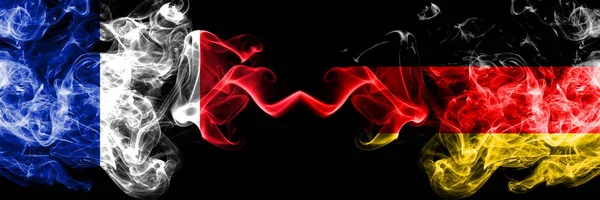 France vs Germany, German smoky mystic flags placed side by side. Thick colored silky abstract smoke banner of French and Germany, German — Stock Photo, Image