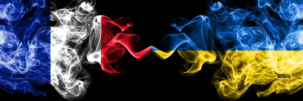 France vs Ukraine, Ukrainian smoky mystic flags placed side by side. Thick colored silky abstract smoke banner of French and Ukraine, Ukrainian — Stock Photo, Image