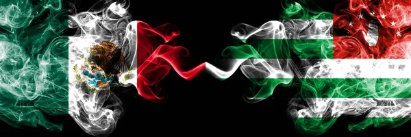 Meksika vs Abhazya, Abhazca dumanlı mistik bayraklar yan yana yerleştirilir. Kalın renkli ipeksi soyut dumanlar meksika ve Abhazya, Abhazya afiş