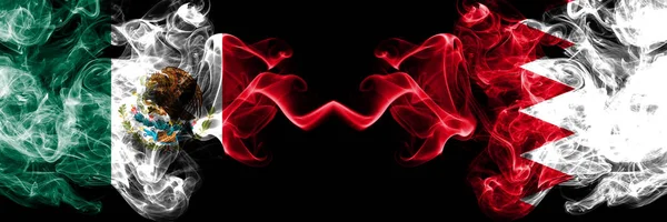 Meksika vs Bahreyn, Bahrani dumanlı mistik bayraklar yan yana yerleştirilir. Kalın renkli ipeksi soyut Meksika ve Bahreyn, Bahrani afiş dumanlar