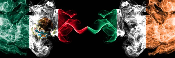 Mexico vs Ireland, Irish smoky mystic flags placed side by side. Thick colored silky abstract smokes banner of Mexican and Ireland, Irish — Stock Photo, Image