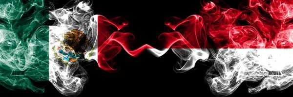 Mexico vs Monaco, Monacan smoky mystic flags placed side by side. Thick colored silky abstract smokes banner of Mexican and Monaco, Monacan — Stock Photo, Image