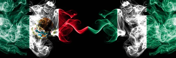Meksika vs Nijerya, Nijerya dumanlı mistik bayraklar yan yana yerleştirilir. Kalın renkli ipeksi soyut Meksika ve Nijerya, Nijerya sancak dumanlar