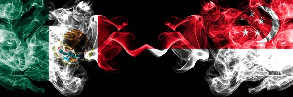 Meksika vs Singapur, Singapur dumanlı mistik bayraklar yan yana yerleştirilir. Kalın renkli ipeksi soyut Meksika ve Singapur, Singapur suiisyenler afiş