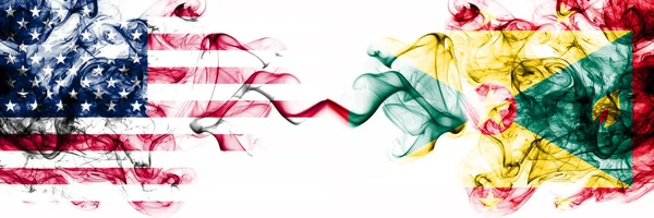 United States of America vs Grenada smoky mystic flags placed side by side. Thick colored silky abstract smokes banner of America and Grenada — 스톡 사진