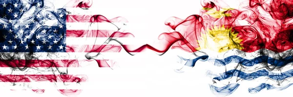 United States of America vs Kiribati smoky mystic flags placed side by side. Thick colored silky abstract smokes banner of America and Kiribati — Stock Photo, Image