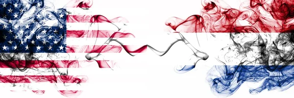 United States of America vs Netherlands, Dutch smoky mystic flags placed side by side. Thick colored silky abstract smokes banner of America and Netherlands, Dutch — Stock Photo, Image