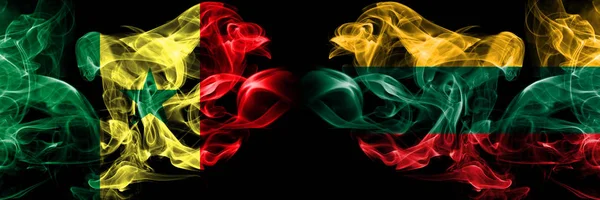Senegal, senegalské, litevské, Litevské kouřové mystické vlajky umístěné bok po boku. Silné barevné označení — Stock fotografie
