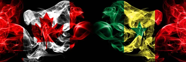 Καναδάς, Καναδέζικα, Σενεγάλη, Σενουά, καπνιστή μυστικιστικές σημαίες τοποθετημένες δίπλα-δίπλα. Παχιά χρώμα μεταξένια καπνίζει ιδέα σημαίας — Φωτογραφία Αρχείου