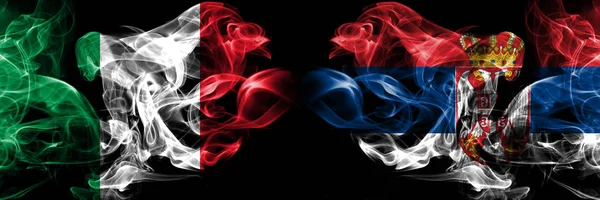 Italy, Italian, Serbia, Serbian smoky mystical flags placed side by side. Thick colored silky smokes flag concept — Stock Photo, Image