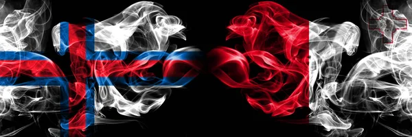 Feröer-szigetek, Málta, máltaiak, flip verseny vastag színes füstös zászlók. Európai futballképesítések játékok — Stock Fotó