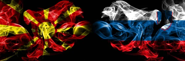 Macedonia, Macedonian, Slovenia, Slovenian, flip competition thick colorful smoky flags. European football qualifications games — Stock Photo, Image