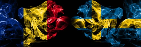 Romania, Romanian, Sweden, Swedish competition thick colorful smoky flags. European football qualifications games — Stock Photo, Image