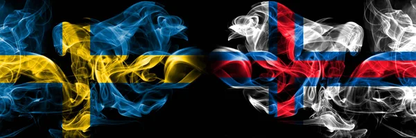 Sweden, Swedish, Faroe Islands competition thick colorful smoky flags. European football qualifications games — Stock Photo, Image